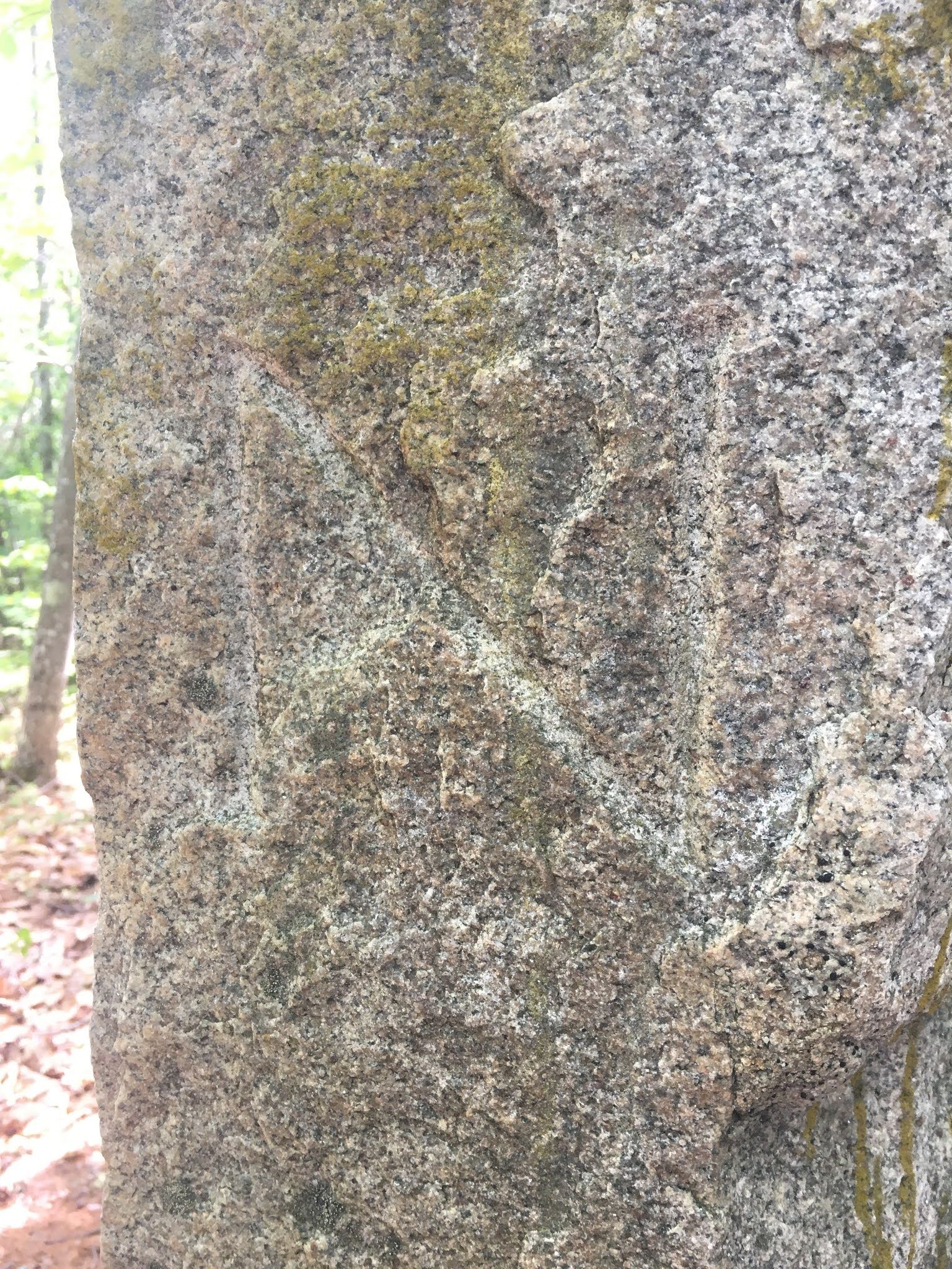 Close-up of pillar showing engraved letter N.