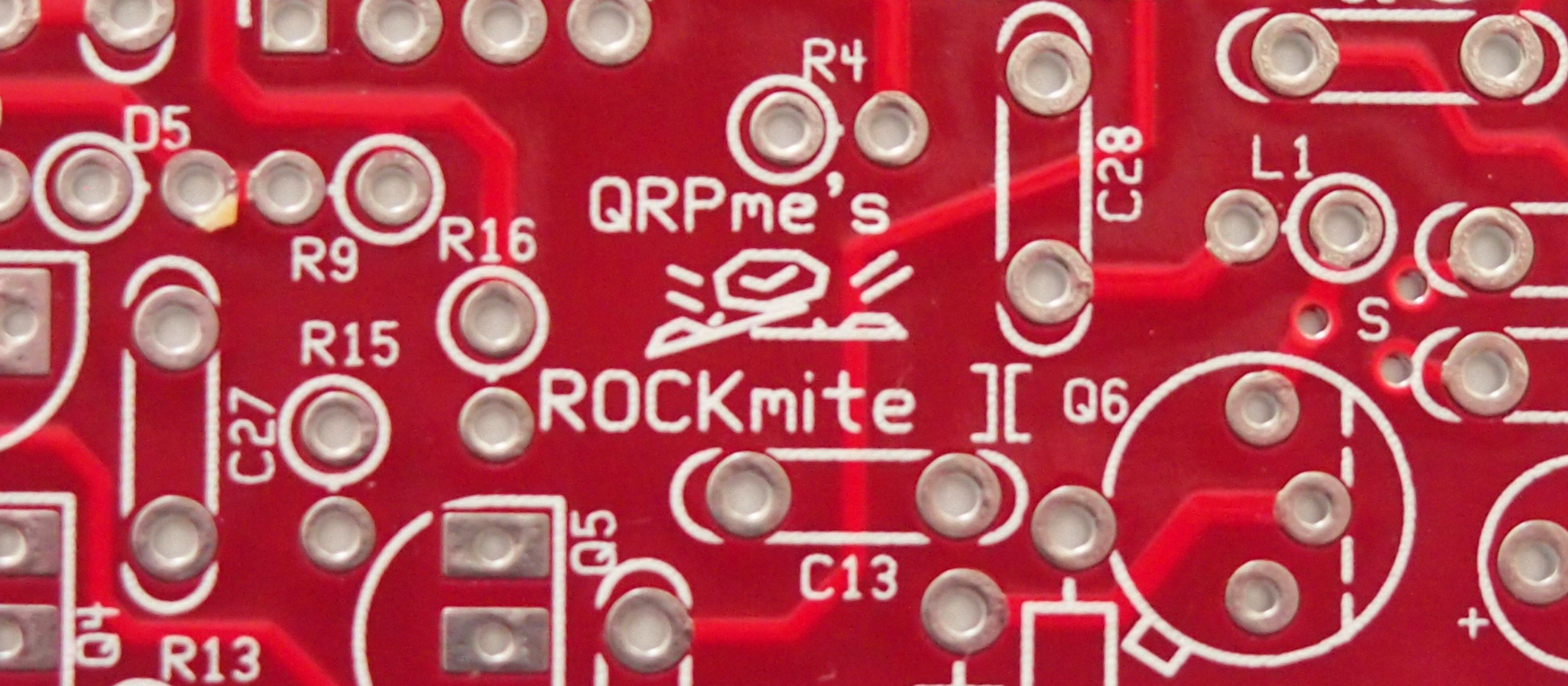 Close up of a red through-hole circuit board labeled "QRPme's ROCKmite "